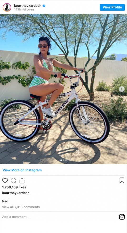 Kourtney Kardashian wears green check...